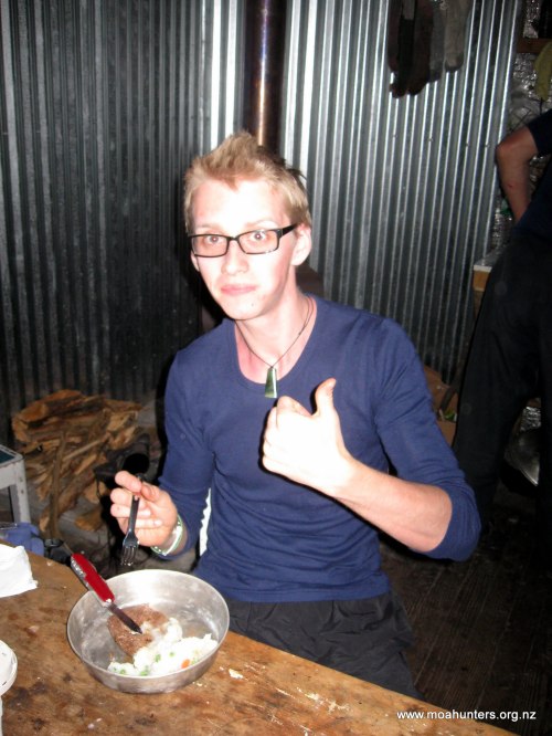 Logan tucks into the marinated steak